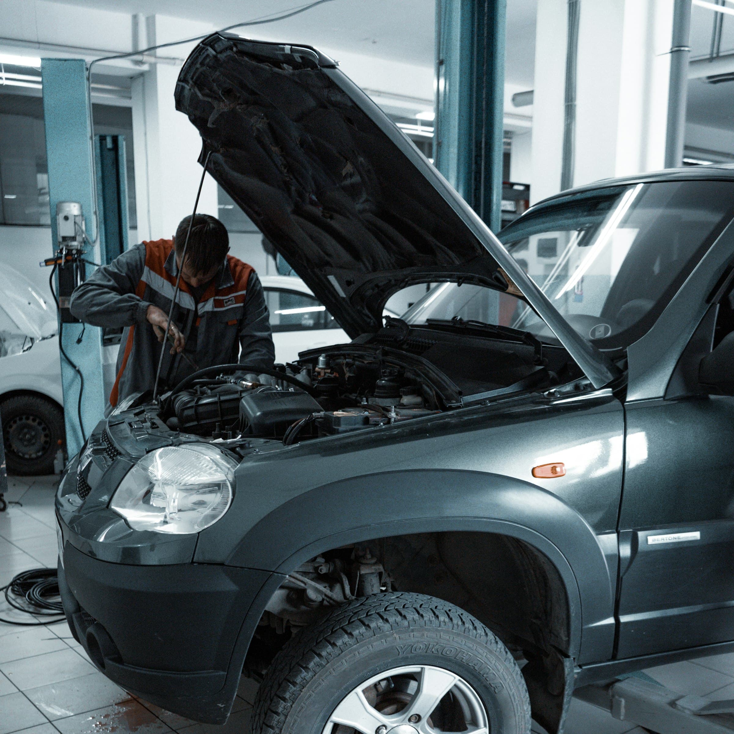 Modern automotive repair shop interior with professional tools and equipment for expert car maintenance and diagnostics